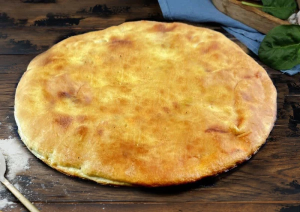 Пирог осетинский с сыром и яйцом