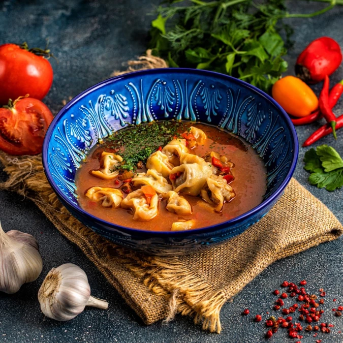 Чучвара ручной лепки с бараниной в мясном бульоне с овощами