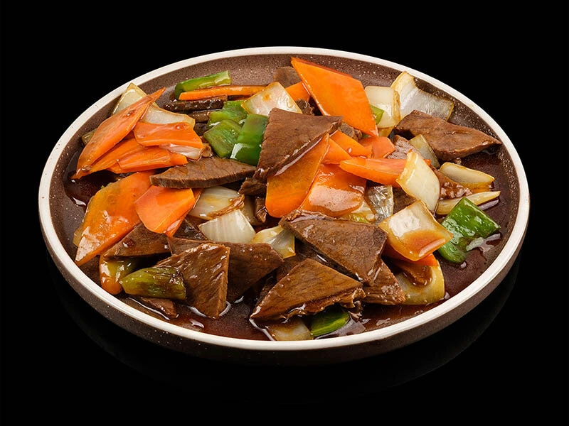 Говядина в соусе с овощами