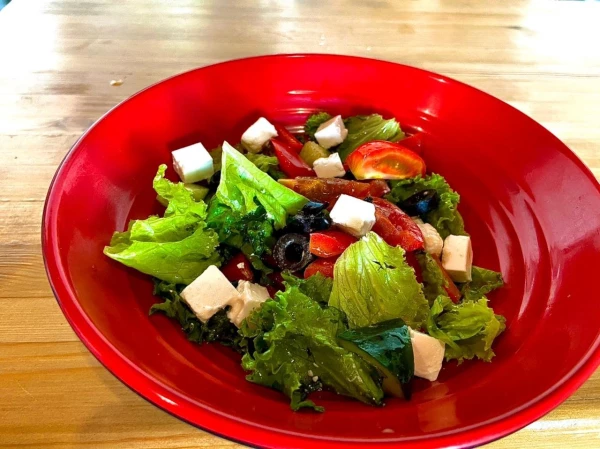 Греческий Акция