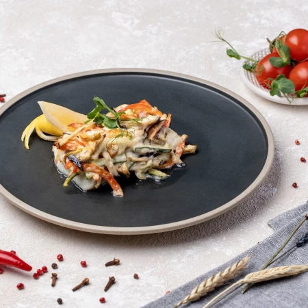 Минтай, запеченный с овощами