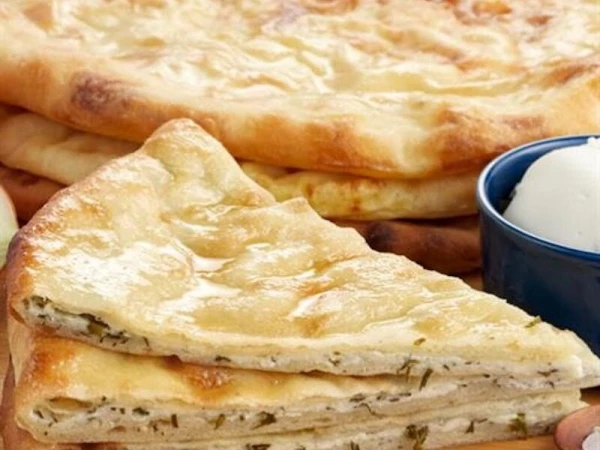 Осетинский пирог с творогом и зеленью